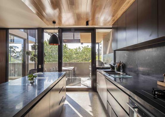 a kitchen with a glass door