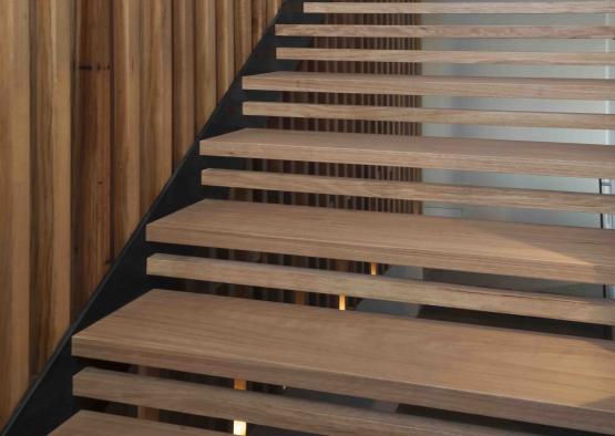 a wooden stairs with a black base