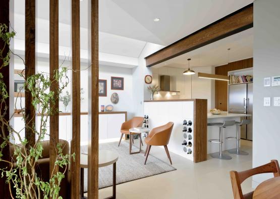 a room with a kitchen and dining area