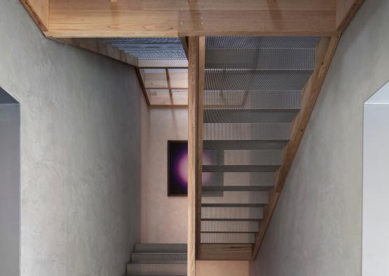a staircase with a wooden beam