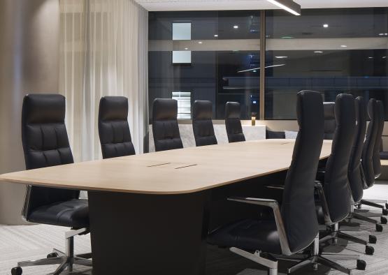 a conference table with chairs in a room