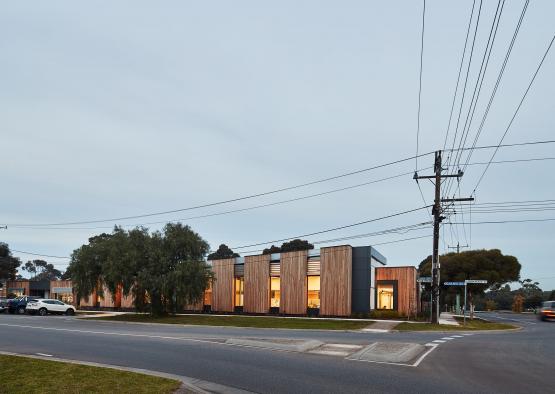 a building with trees and power lines