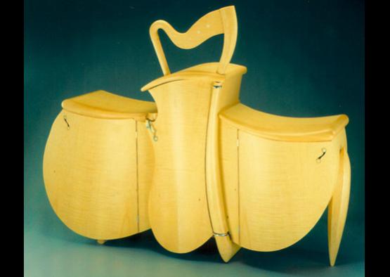 a yellow wooden chair with a handle