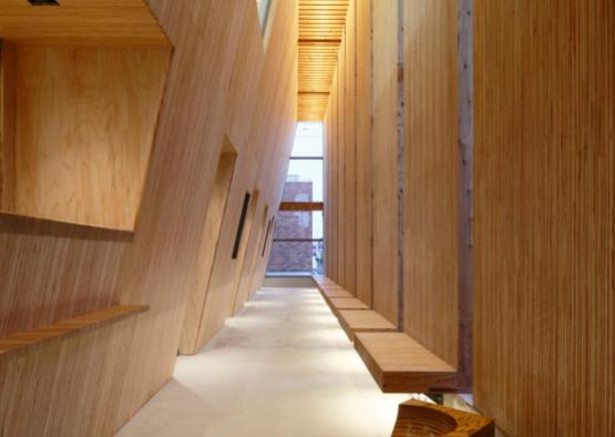 a long hallway with wooden walls