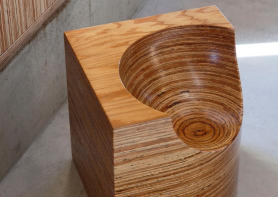 a wooden bowl with a hole