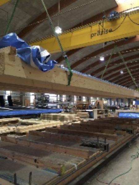 a large warehouse with wooden beams