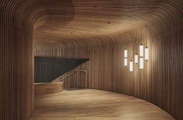 a wooden room with light fixtures