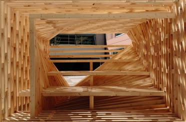 a wood structure with a square frame