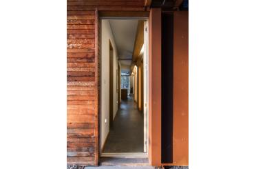 a hallway with wood walls and a wood wall