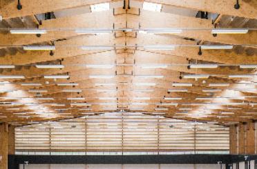 a large wooden structure with lights