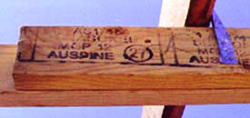 a piece of wood with writing on it