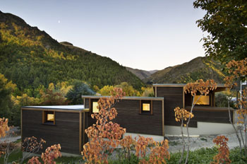 Arrowtown House – Dark horizontal cedar weatherboards with small openings to street