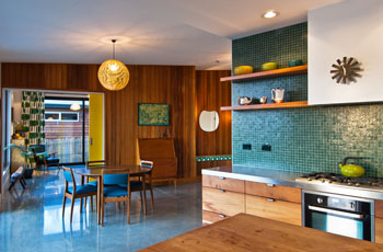 Nelson House – Cedar cladding extends inside giving the house a 70s feel. The kitchen is macrocarpa