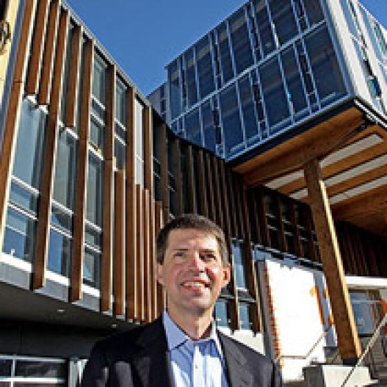 a man standing in front of a building