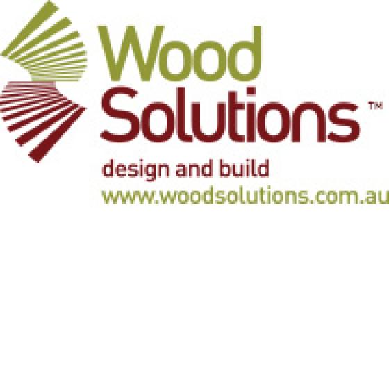 a logo for wood solutions