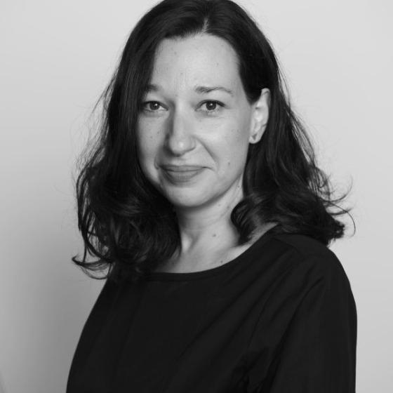 a woman with long hair wearing a black shirt