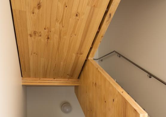 a wooden staircase with metal railing