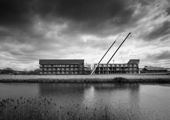 a building next to a body of water