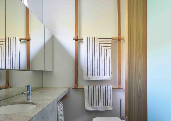 a bathroom with a sink and towels