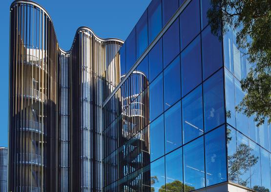 a glass building with a staircase