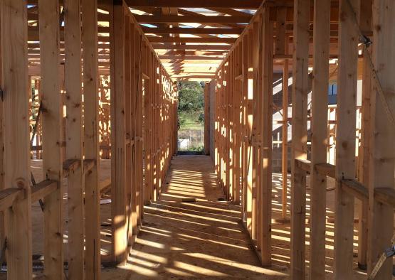 a wooden structure with a light shining through