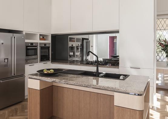 a kitchen with a sink and a mirror