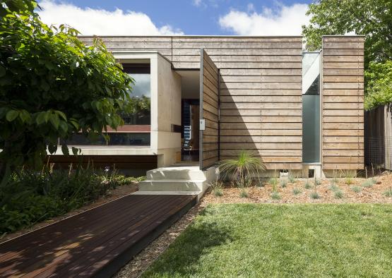 a house with a walkway and a walkway leading to it