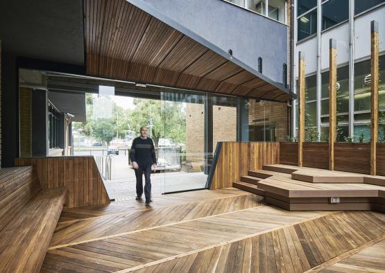 a man standing outside of a building