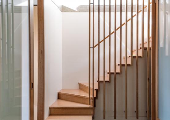a wooden staircase with a railing