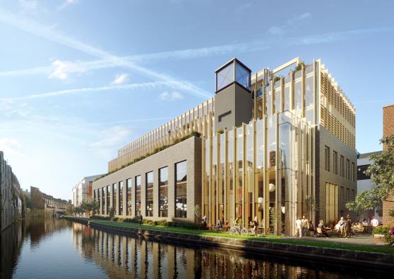 a building with glass walls and a river