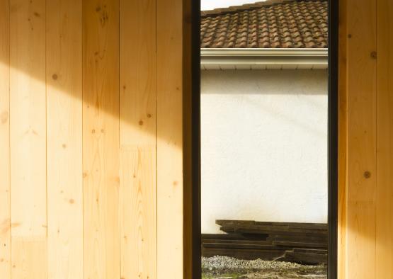 a window in a wood wall