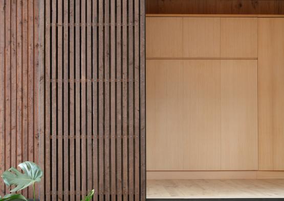 a wood wall with sliding doors