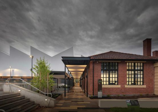 a building with a walkway and stairs