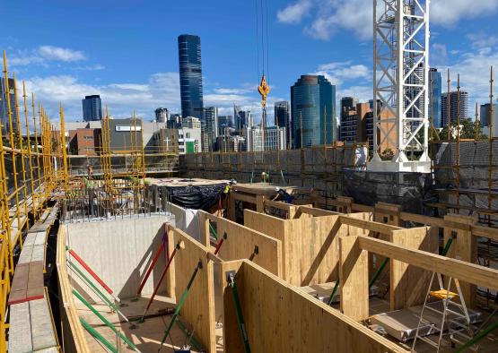 a construction site with a city in the background