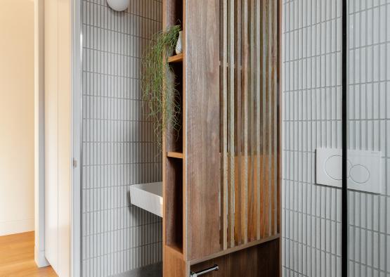 a bathroom with a wood shelf and a sink