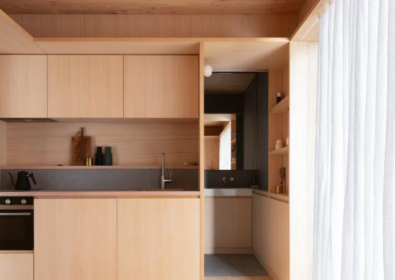a kitchen with wood cabinets and a sink
