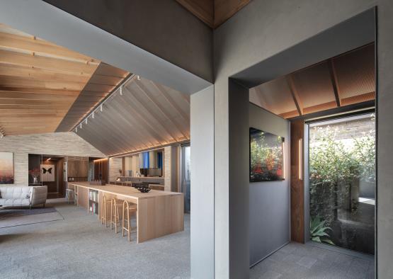 a room with a kitchen and dining area