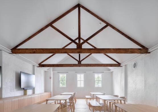 a room with tables and benches