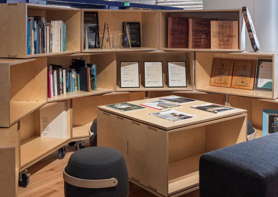 a shelf with books and a table