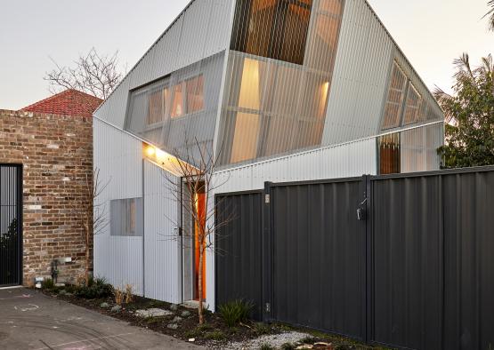 a house with a fence and a gate