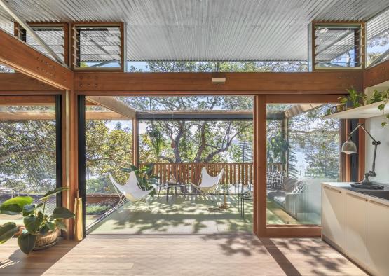 a patio with a deck and chairs