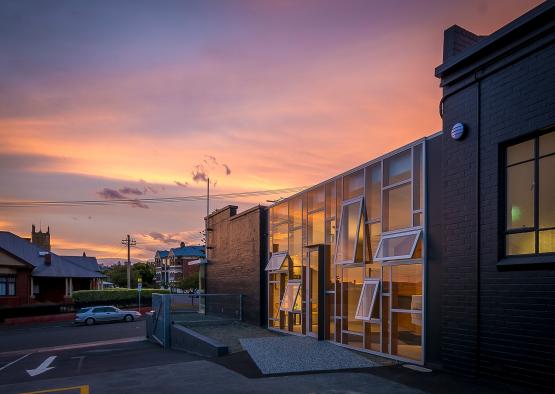 a building with windows and a parking lot