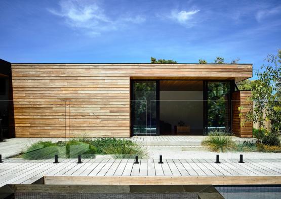 a building with a pool and a glass wall