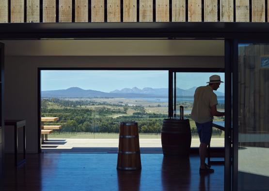 a man standing in front of a glass wall