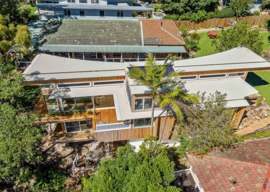 a building with trees and a yard