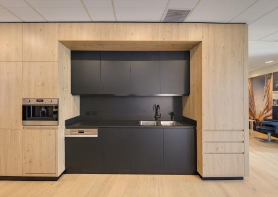 a kitchen with a sink and a microwave