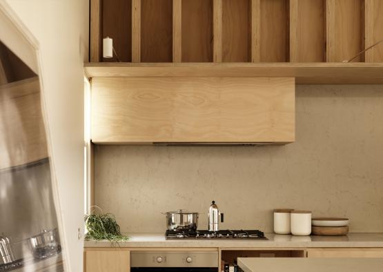 a kitchen with a stove and a pot on top