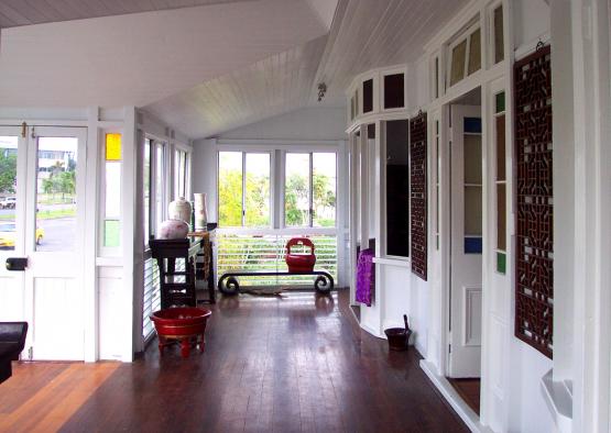 a room with a bench and a wood floor