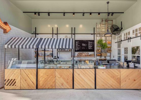 a bakery with a striped awning