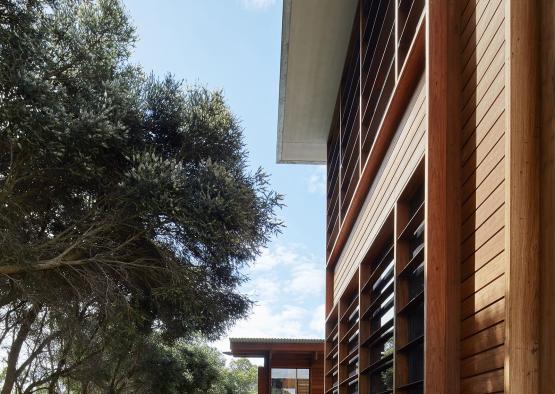 a building with trees and grass